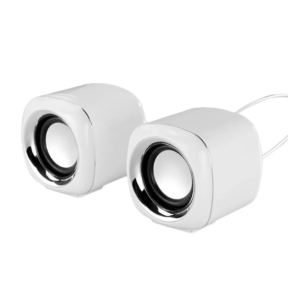 Compact black wired desktop speaker pair with 3.5mm plug measuring 7.2cm