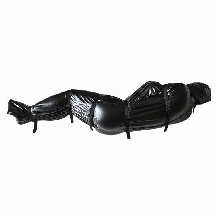 Black patent leather restraint set showing full body wrap harness and six ratchet tie down straps