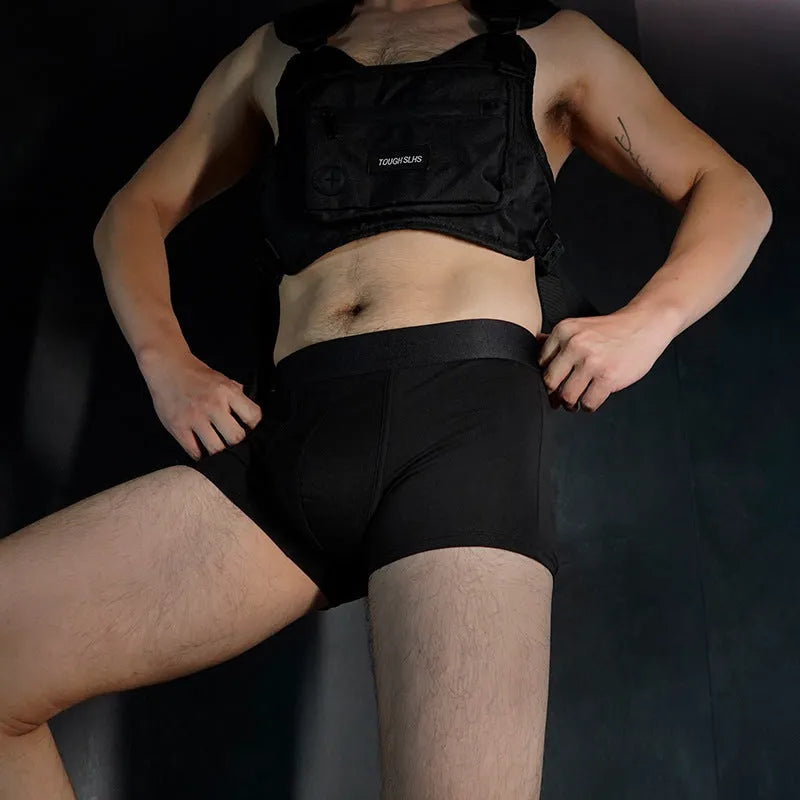 Men's solid colour cotton boxer shorts in black, white, grey, and light green.