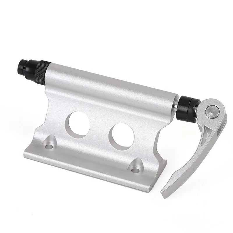 Silver metal quick release fixing clip for bicycle front fork on a white background.