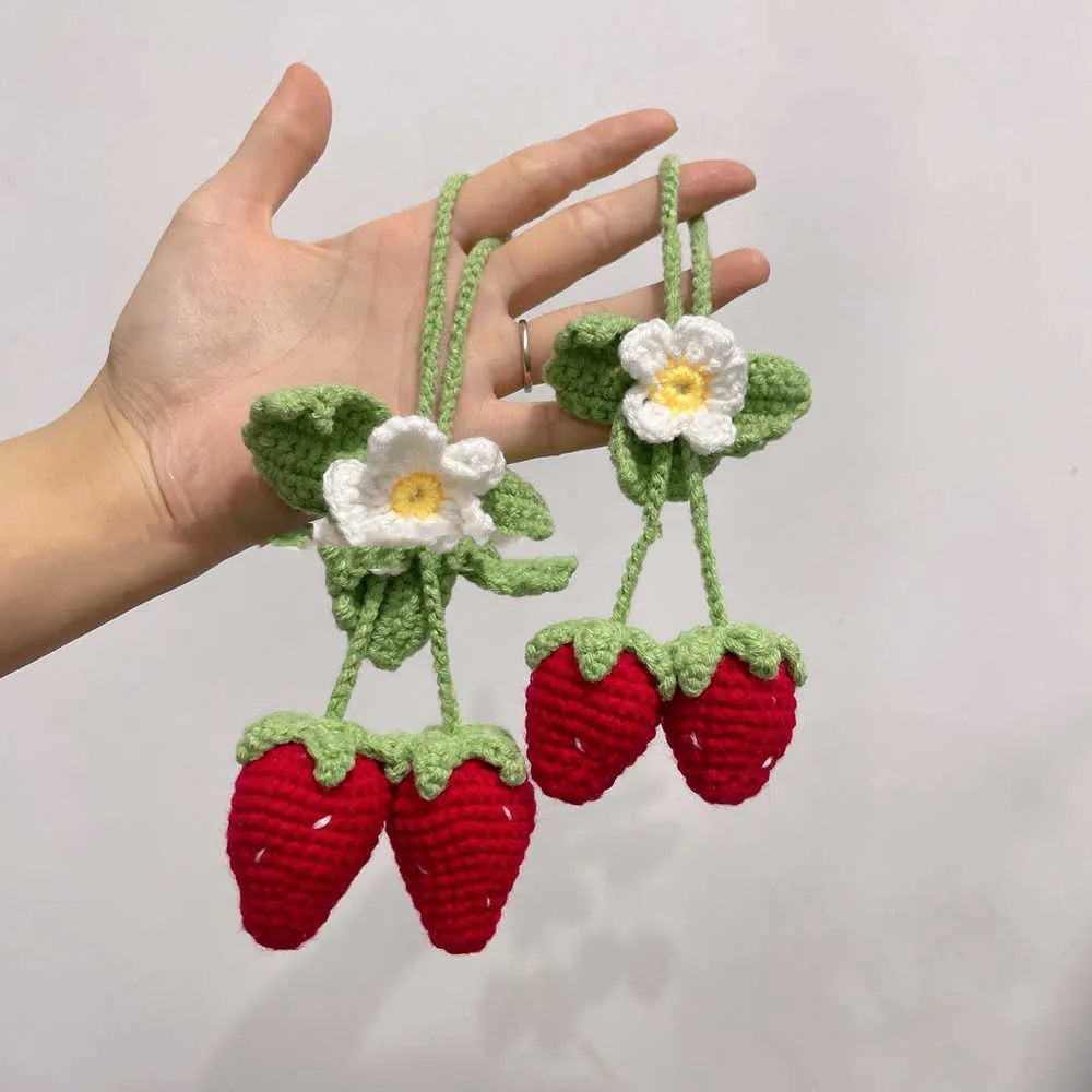 Handmade strawberry-shaped car pendant woven from cotton and hemp, a hanging decorative ornament.