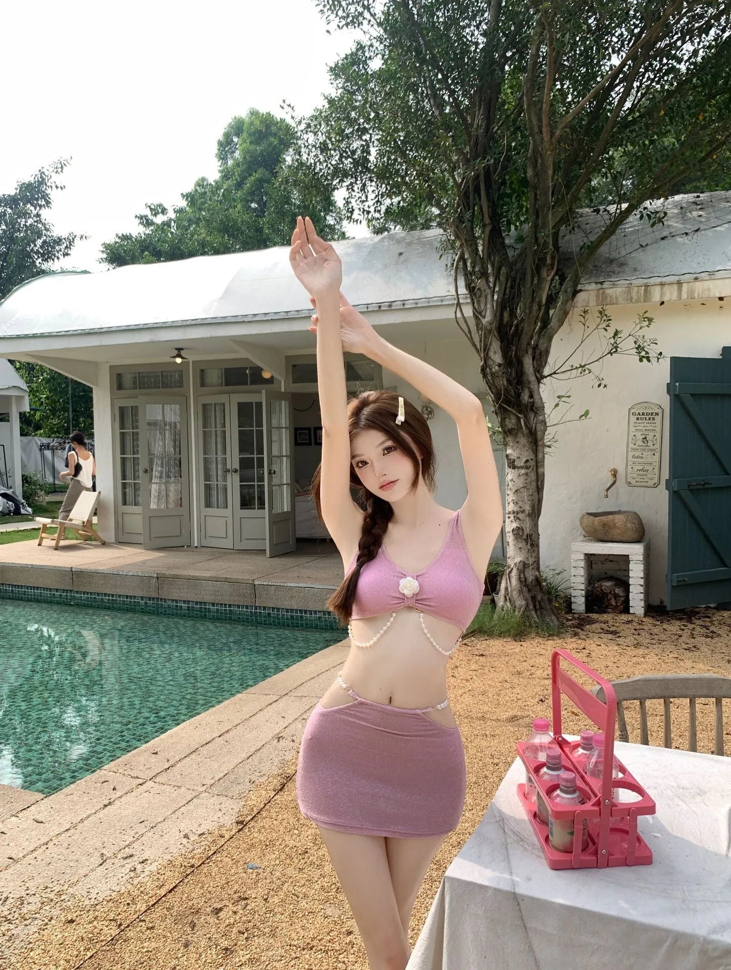 Women's pink three-piece bikini set with backless briefs for swimming and hot spring use