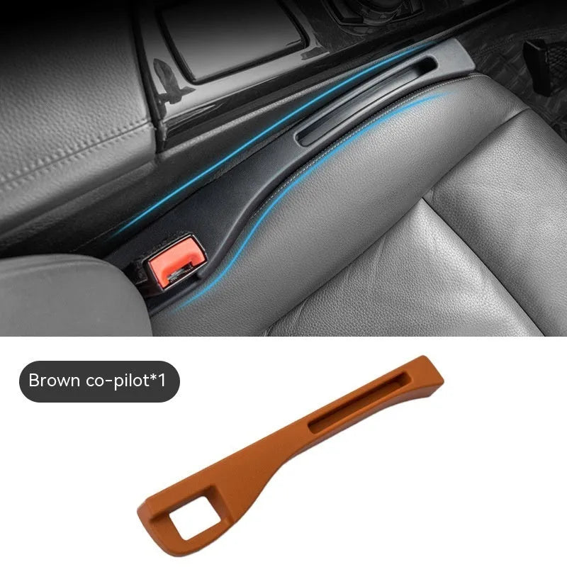 Black car gap storage box with handle placed between vehicle front seats