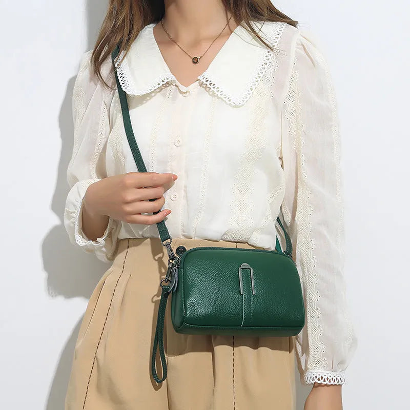 Genuine cowhide leather women's shoulder bag with horizontal square shape in dark green colour.