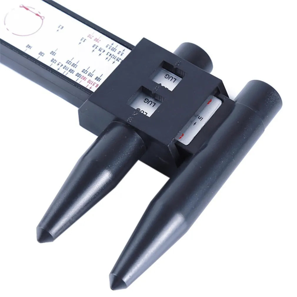 Digital electronic caliper hole distance measuring tool made from black plastic on a white background.