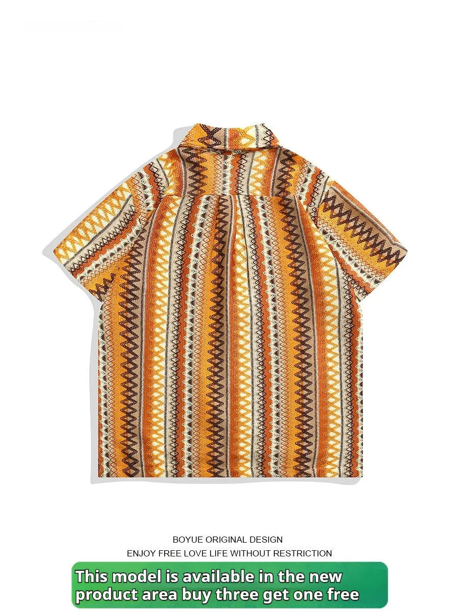 Man wearing a loose-fit ethnic style woven shirt with a Cuban collar and contrast colours.
