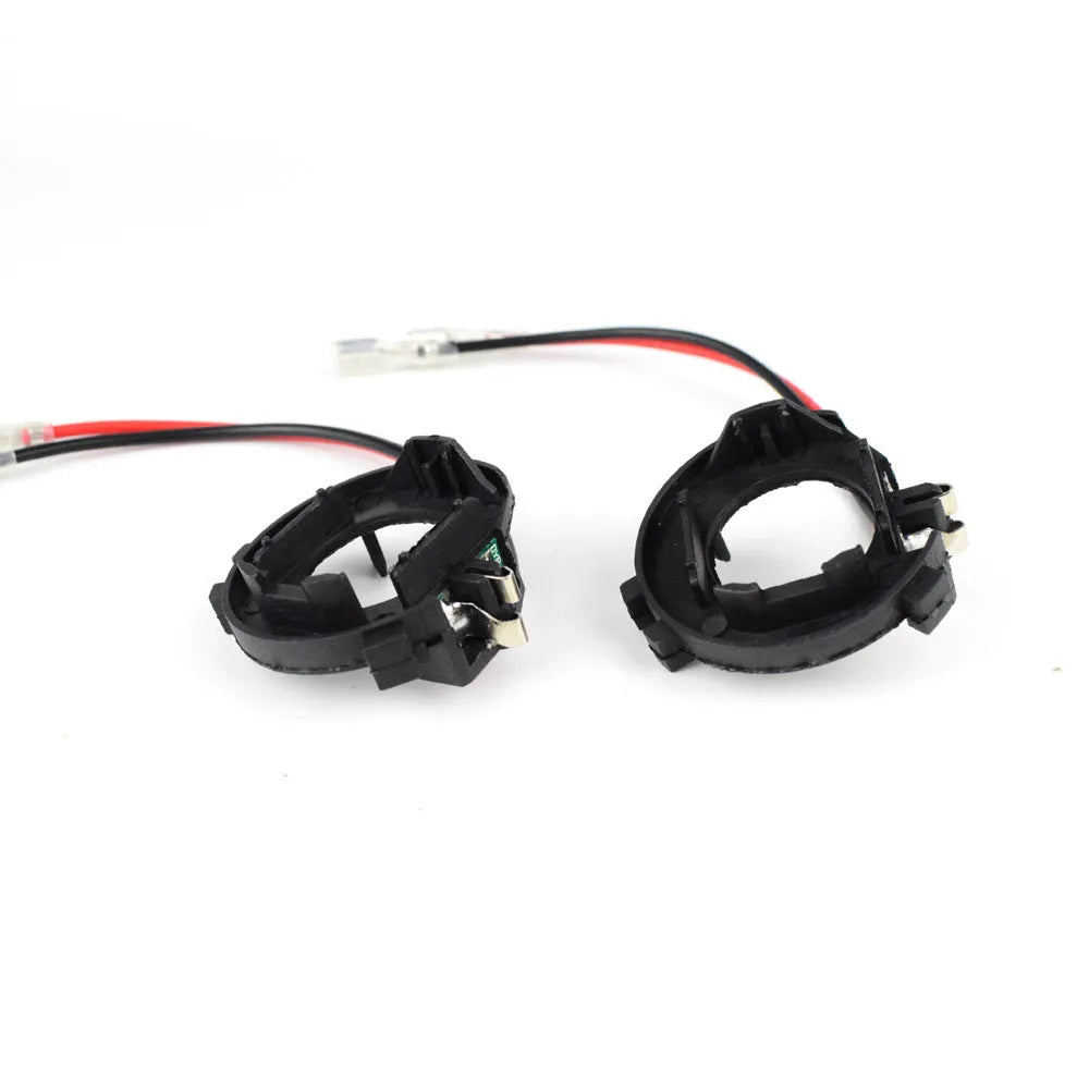 Black H7 LED headlight adapter bracket for Volkswagen vehicles with copper wire connections