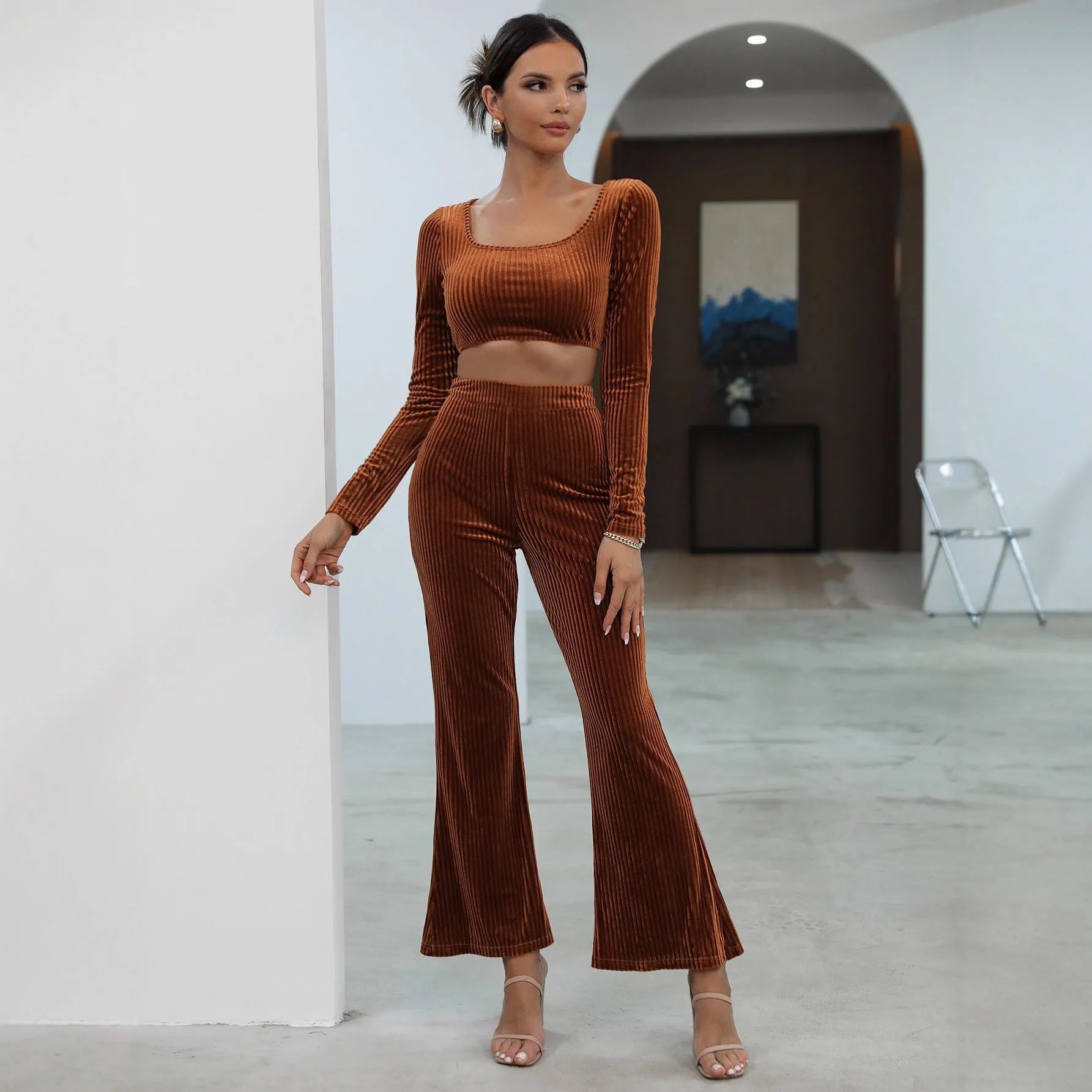 Caramel coloured long sleeve sweater and trousers casual set on a hanger