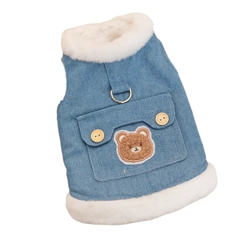 Denim blue pet vest with white wool lining, bear print, wooden buttons, and metal D-ring.