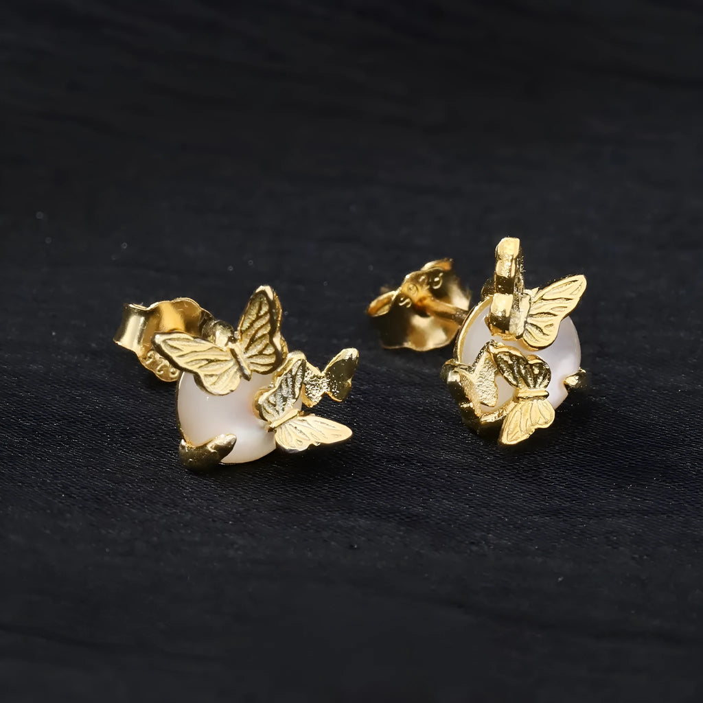 A pair of butterfly-shaped stud earrings in 925 silver with a gold electroplated finish.