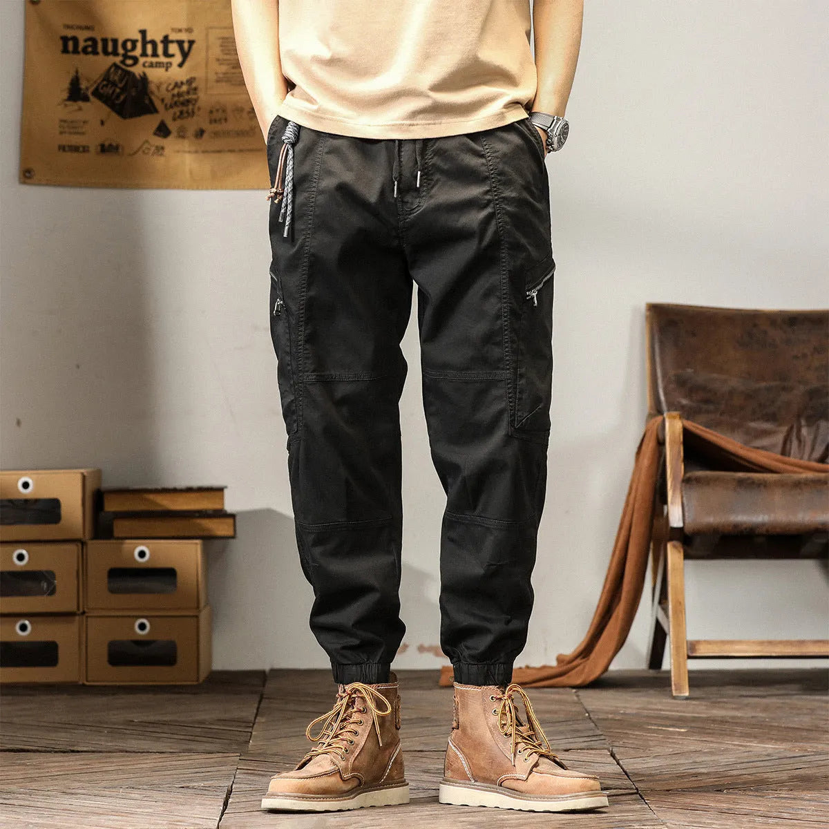 Men's khaki cotton tapered harem pants with a small ankle opening and mid-waist design on a neutral background.