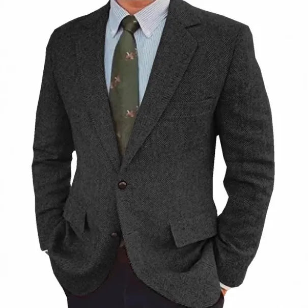 Men's brown herringbone pattern retro suit jacket with long sleeves on a hanger.