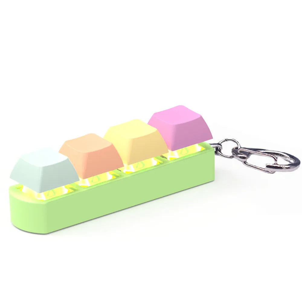 Four-key mechanical keyboard switch shaft tester with coloured keycaps and transparent base on a desk.