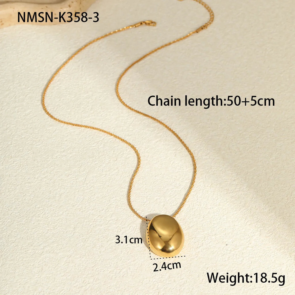 Gold geometric pendant necklace on adjustable stainless steel chain, shown at 41cm length.