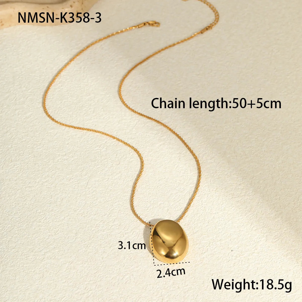 Gold geometric pendant necklace on adjustable stainless steel chain, shown at 41cm length.