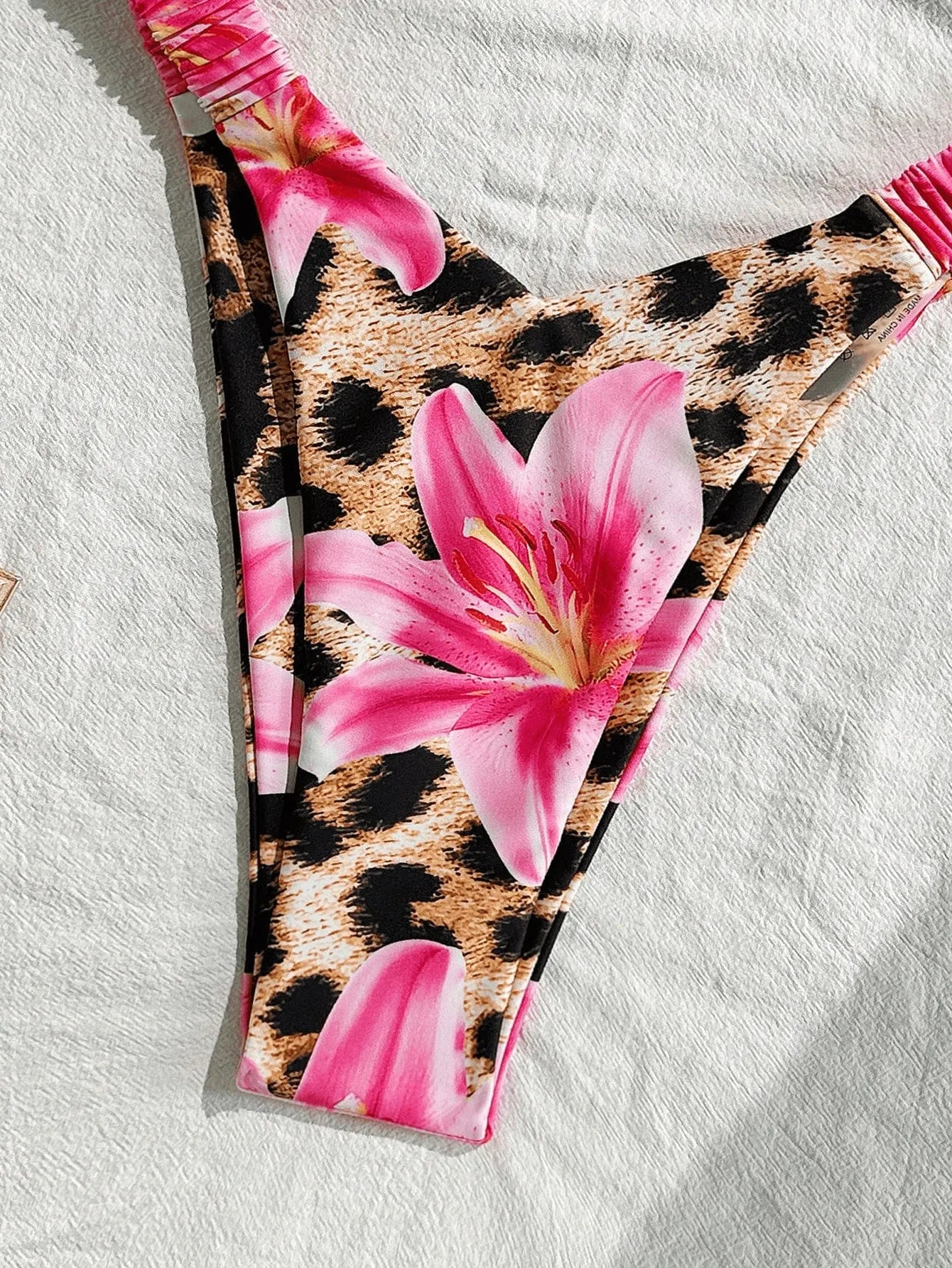 Pink leopard print women's tube top split bikini swimsuit on white background