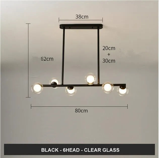 Glass bubble ball chandelier with black iron frame, clear glass shades, and multiple arms