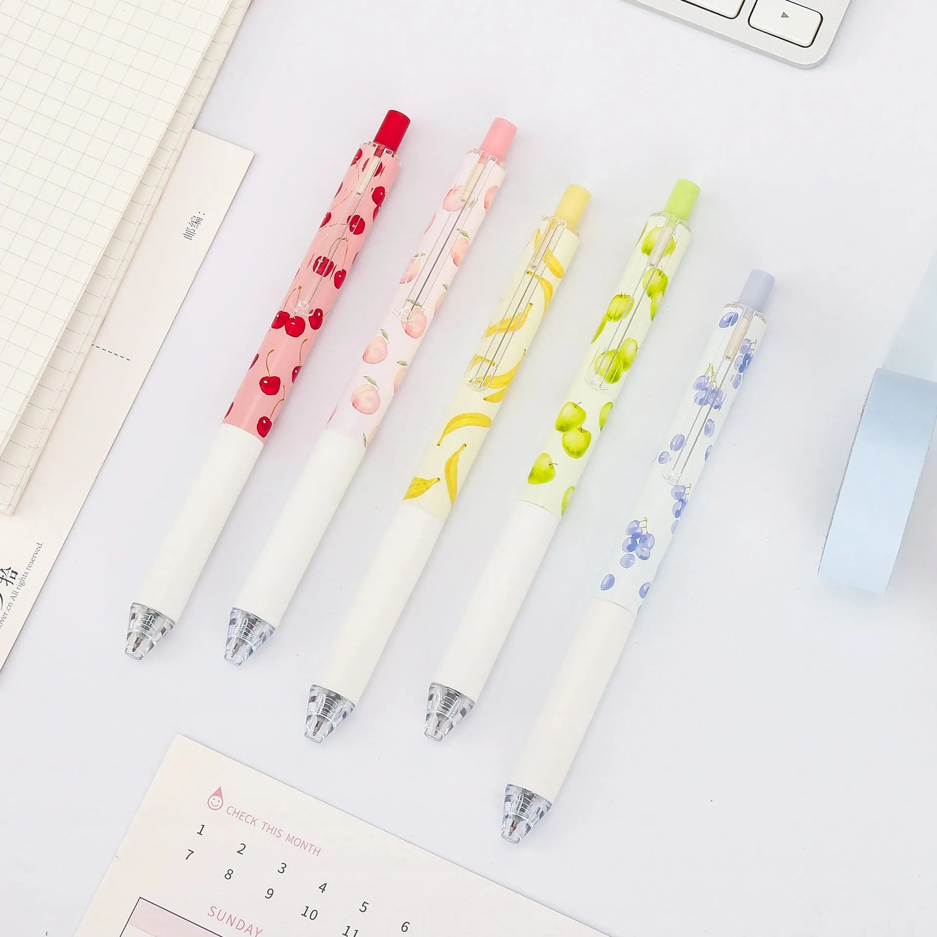 Three fruit-scented pressurised pens with 0.5mm black refills and plastic barrels