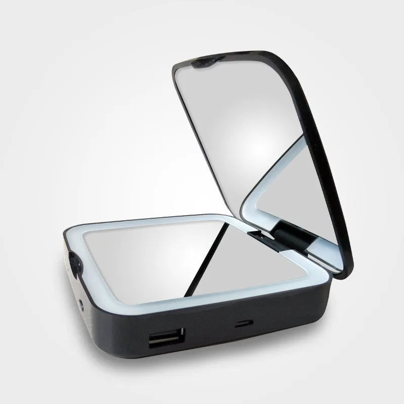 Black and white lighted vanity makeup mirror showing 4x magnifying side and regular mirror with adjustable LED lights.