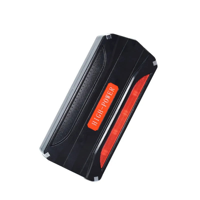 Black and red coloured portable 12V car jump starter emergency power supply unit.