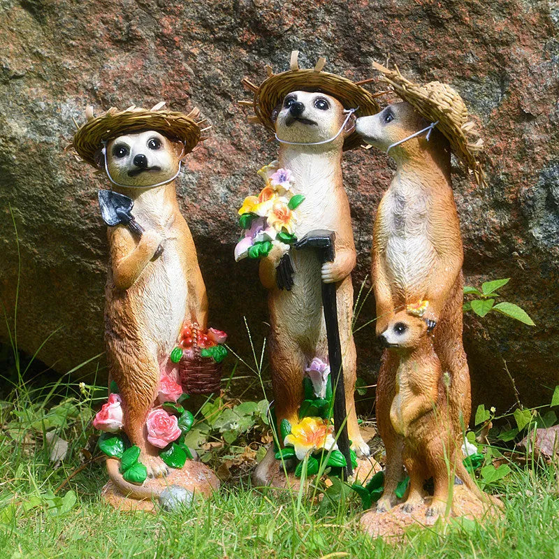 Three straw hat mongoose resin ornaments for garden decoration: mother and son, with rake, and with shovel.