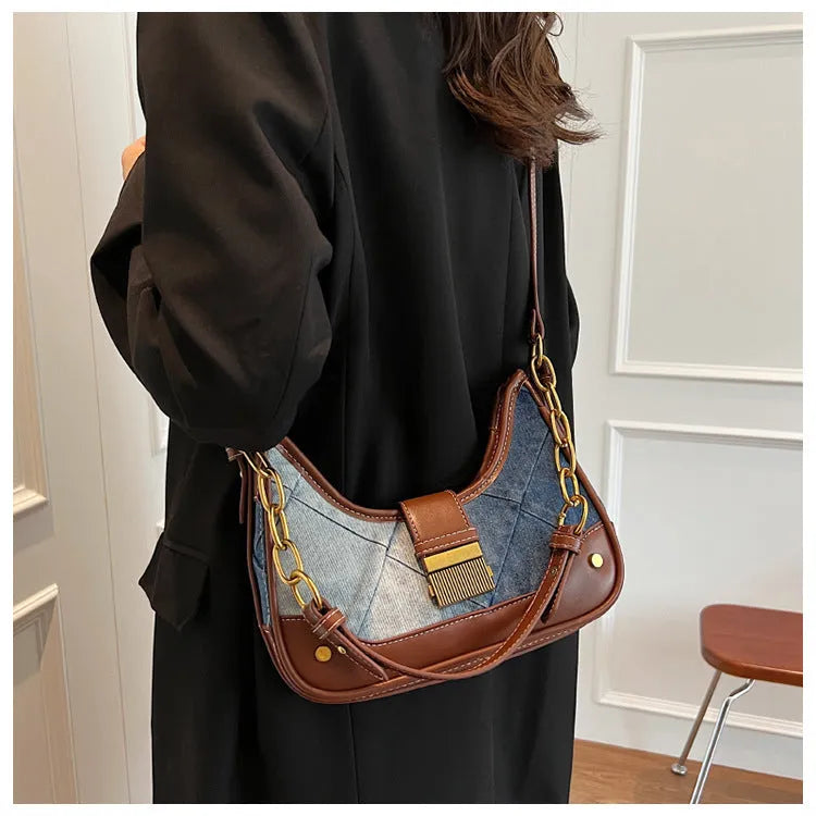 Brown denim women's bucket shoulder bag with diamond chain straps and lock detail