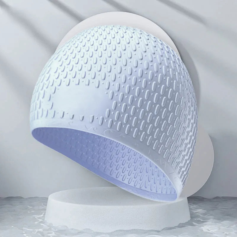 A solid colour silicone swimming cap for adults, shown in one of nine available colour options.