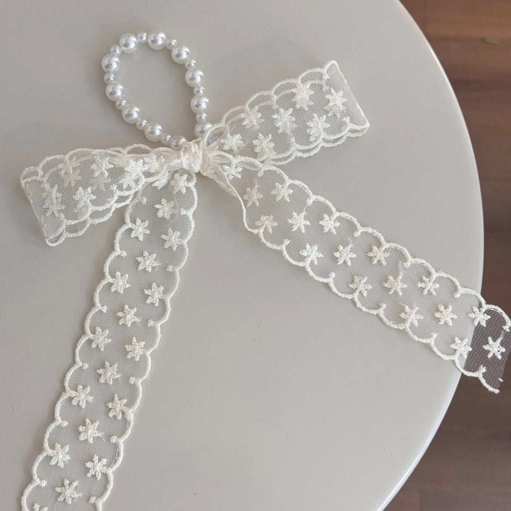 Fabric hair clips with lace, bow, and pearl butterfly designs for women