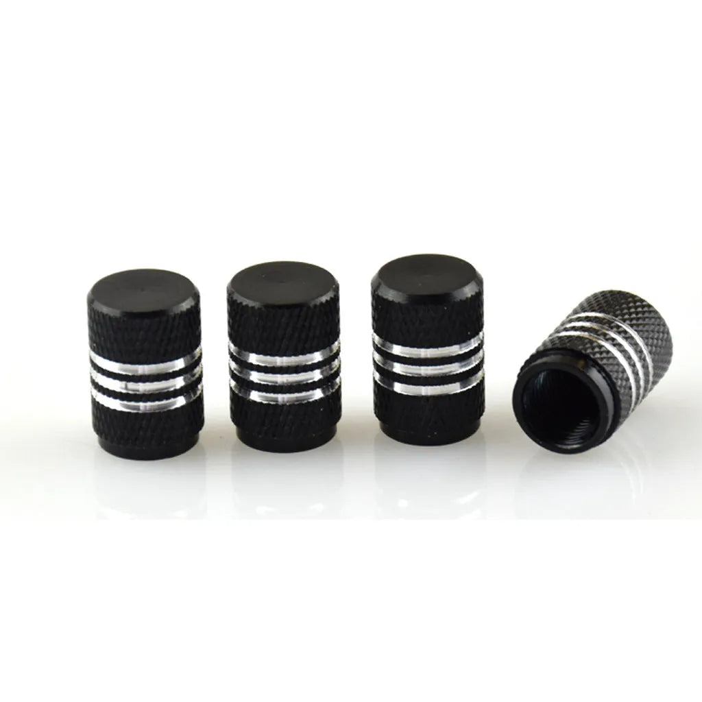 Set of aluminium alloy car tyre valve caps in multiple metallic colours showing stainless steel construction
