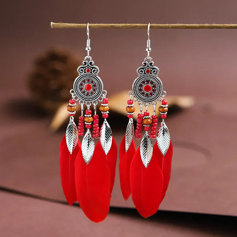 Round drop feather earrings with leaf pattern in alloy metal, available in multiple colours