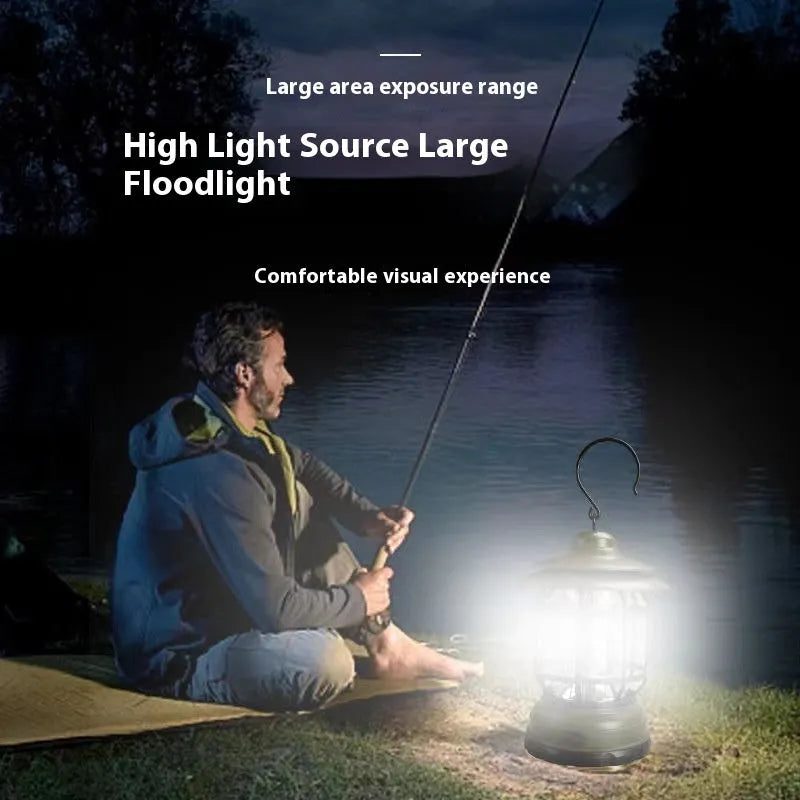 Dark green portable LED camping lantern with head strap, shown on a table with dimensions 16.6cm high.