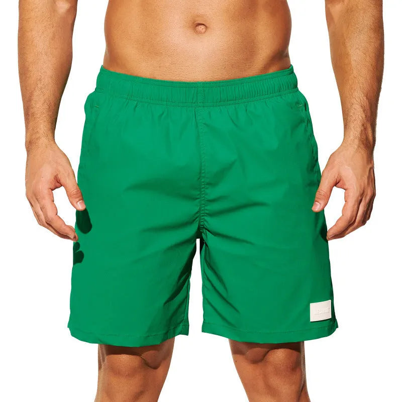 Men's solid colour quick-dry nylon beach shorts with straight leg opening