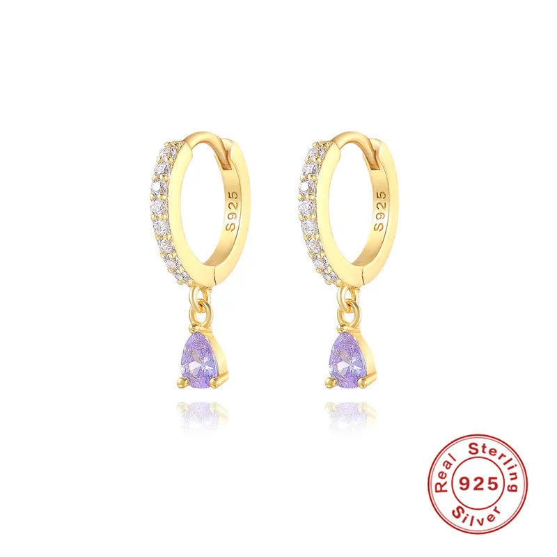 A pair of S925 sterling silver geometric water drop stud earrings on a gold or silver background.