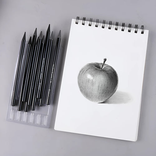 Set of nine wooden drawing pencils on a suction card, containing three carbonised and six graphite solid core pencils for artists.