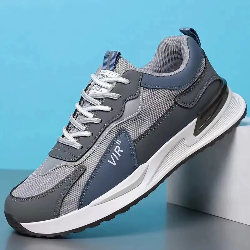 Men's colour block mesh lace-up sneakers in black, grey, and white on a injection moulded sole.
