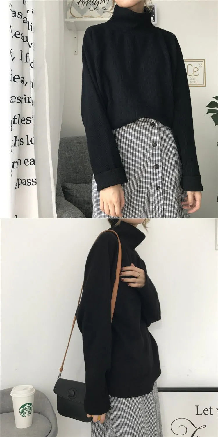 Women's loose fit long sleeve top in solid colour with a half-high collar.