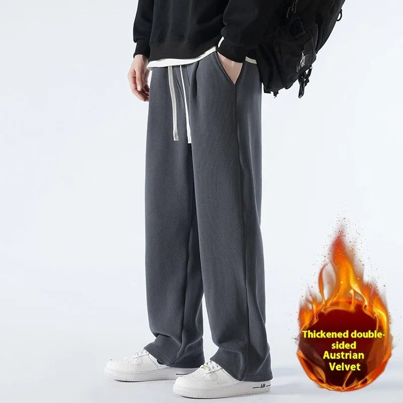 Man wearing apricot double-sided polar fleece lined loose fit casual sports trousers.