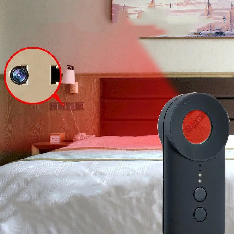 Black portable GPS and hidden camera signal detector showing compact size and Micro USB charging port.