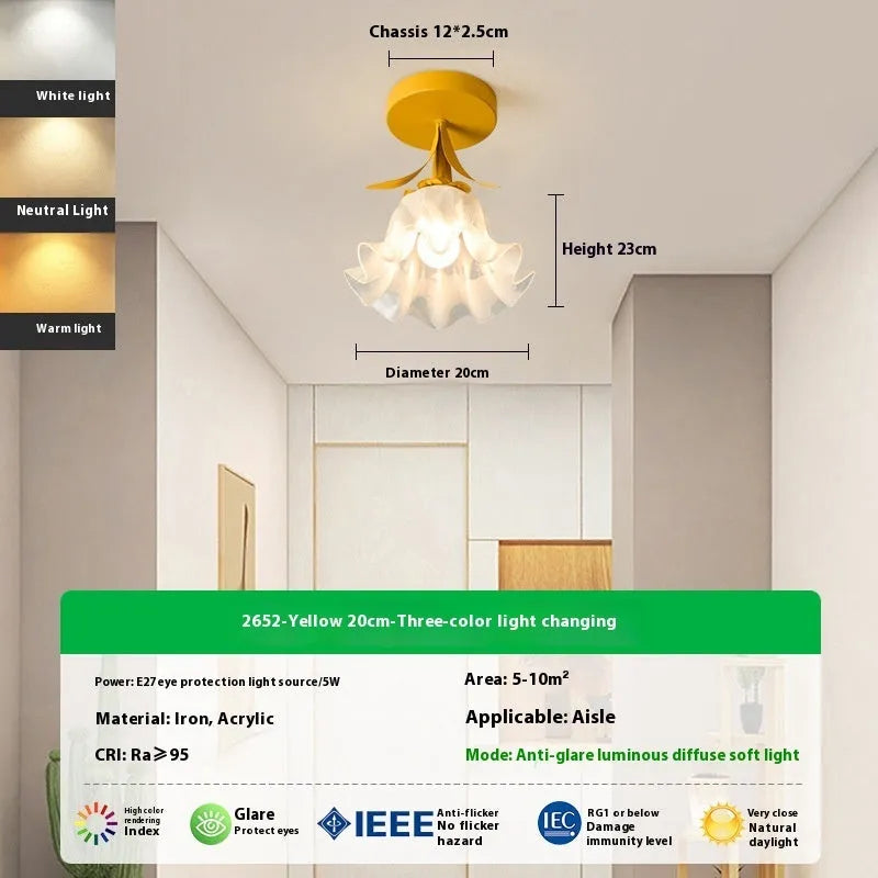 Cream coloured modern LED corridor wall light with remote control for three-colour changing and dimming.