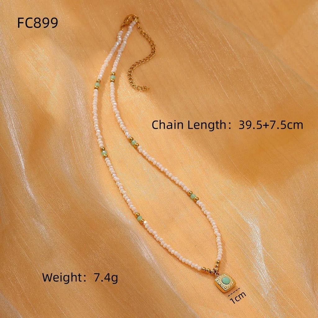 Women's sunflower colour crystal bead necklace with rhodochrosite accents, stainless steel chain, and 18K gold-plated geometry pendant.
