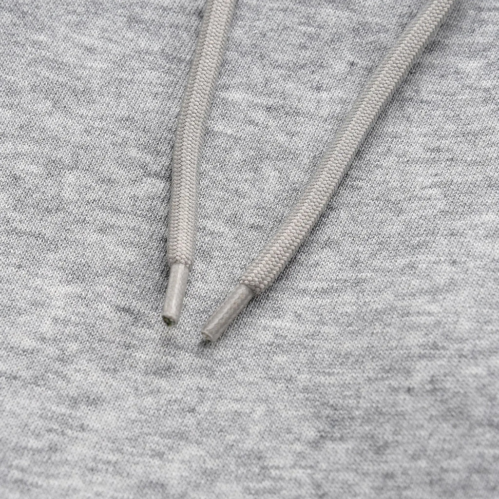 Men's solid colour cotton straight leg trousers with a loose wide-leg casual fit on a hanger.