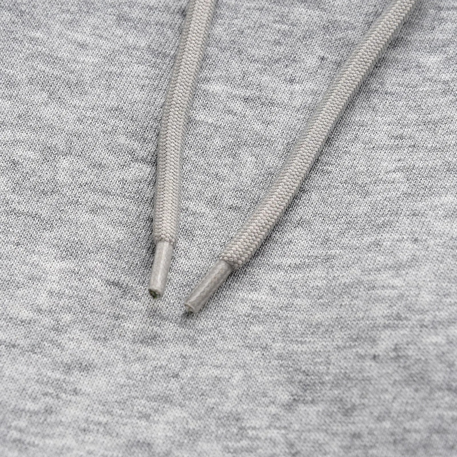 Men's solid colour cotton straight leg trousers with a loose wide-leg casual fit on a hanger.