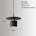 Modern minimalist black droplight pendant 20cm diameter on ceiling over a bedside table