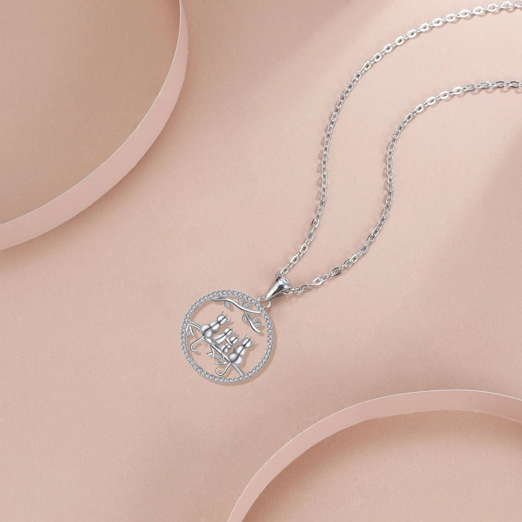 Four kitten pendant necklace on copper cross chain for women