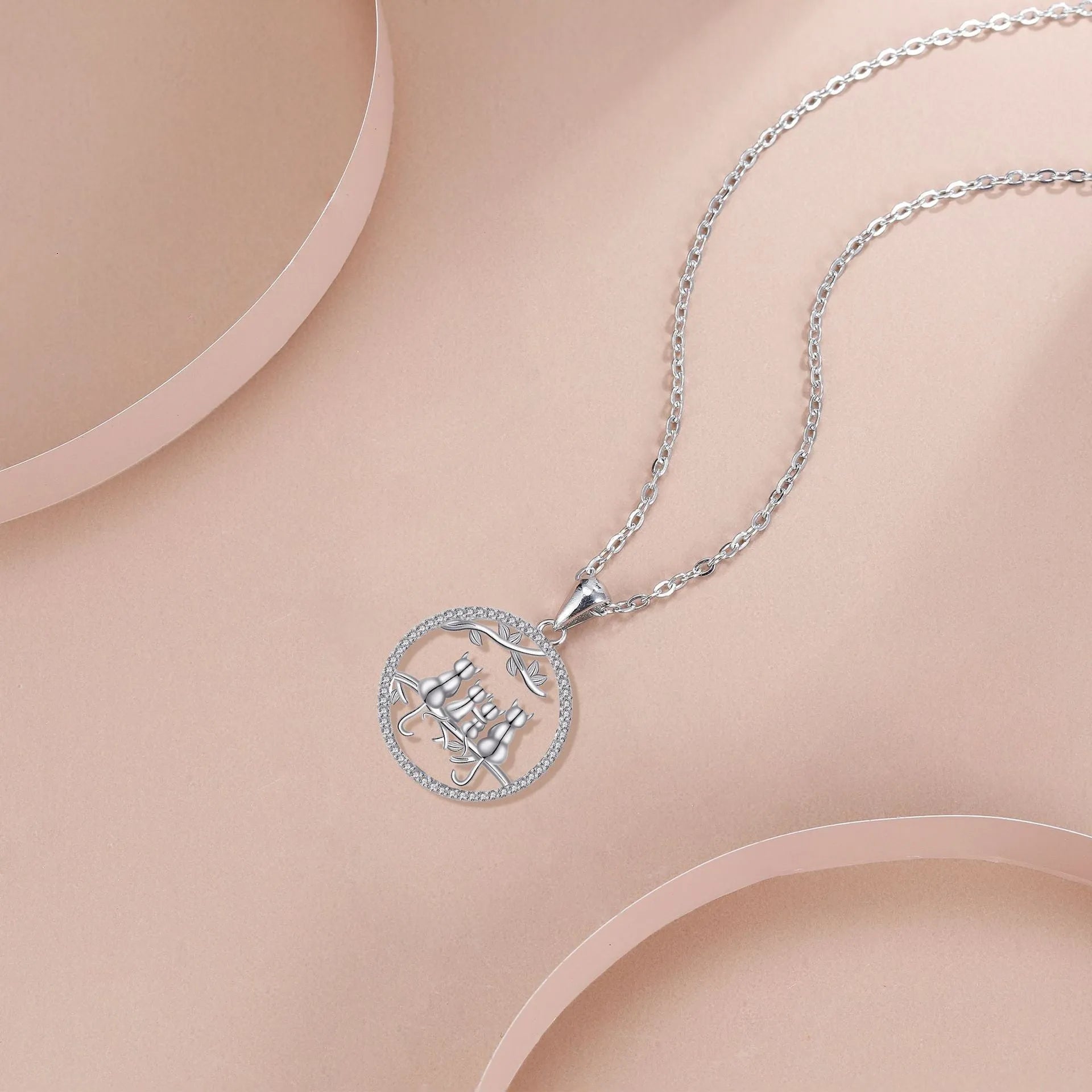 Four kitten pendant necklace on copper cross chain for women