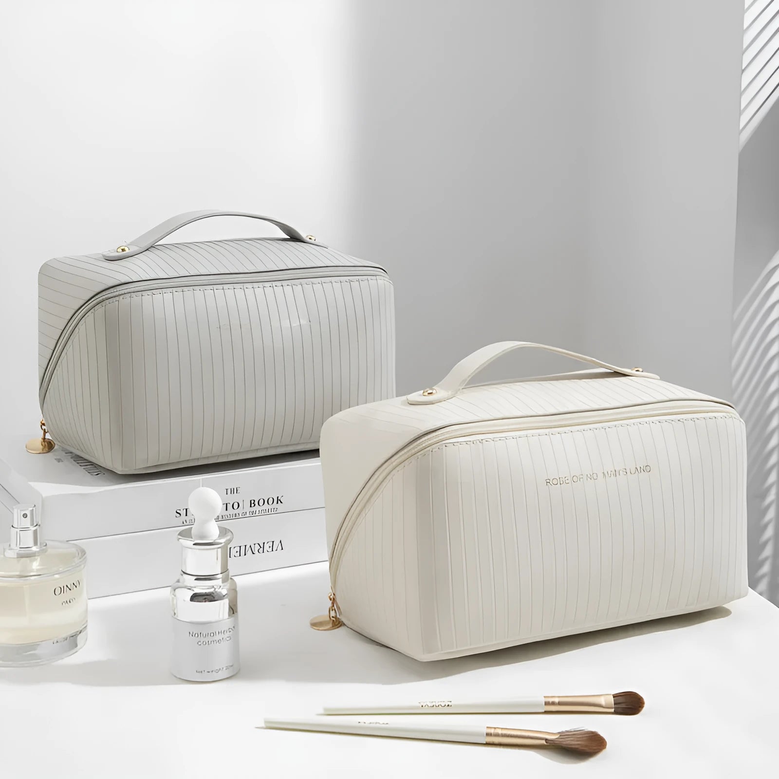 Vertical pattern cubic PU makeup bag in beige, shown with dimensions 22.5cm by 12.5cm.