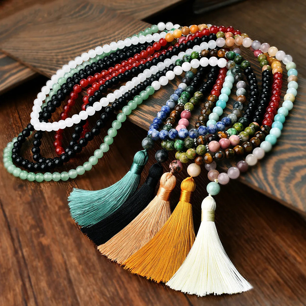 Long beaded bohemian necklace with 108 natural stones, a geometric pendant, and colourful tassels on an 81cm chain.