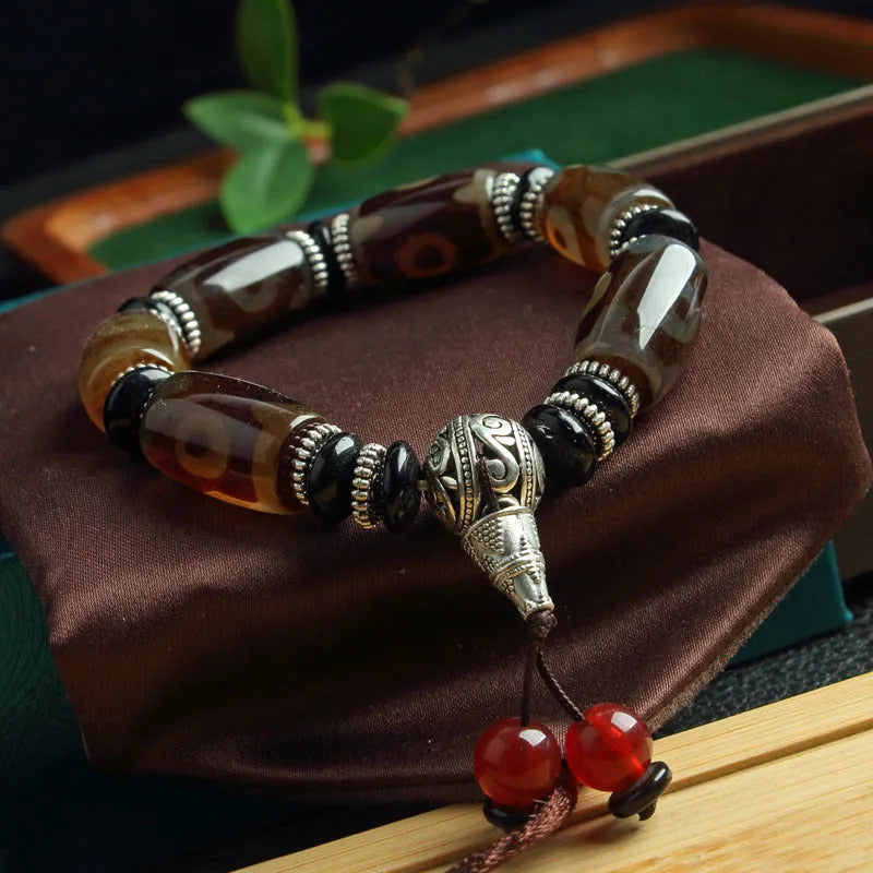 Distressed agate Tibet beads bracelet with three eye dzi design and polished stone beads