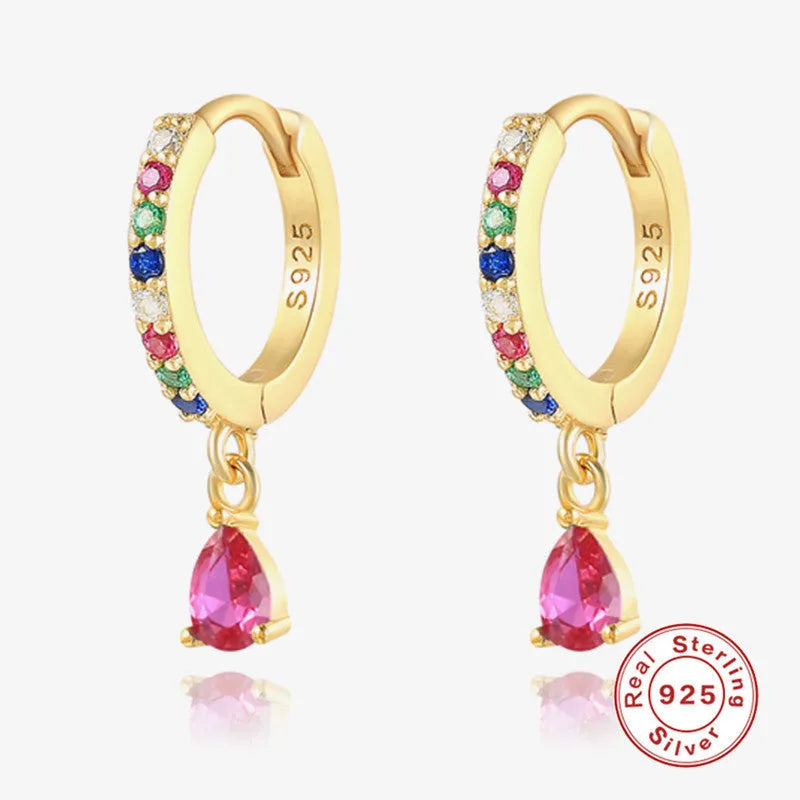 A pair of S925 sterling silver geometric water drop stud earrings on a gold or silver background.