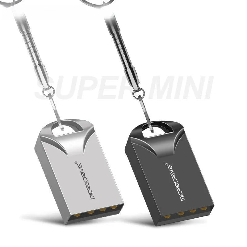Small black and silver metal USB flash drive on a white background showing its compact size.